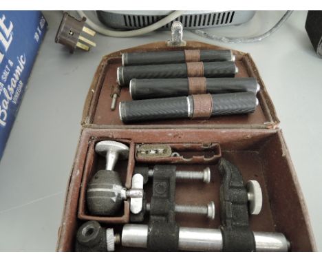 A Rowi case camera clamp and mini tripod