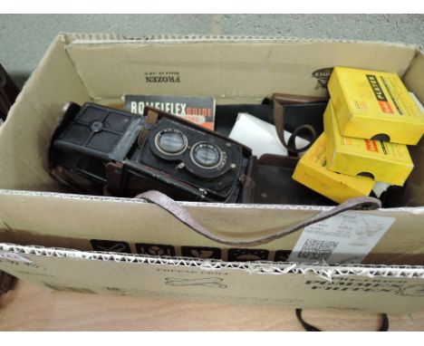 A box containing a Franke & Heidecke Braunscheig Rolleiflex cameras with Campur shutters and Carl Zeiss Jena lenses, several 