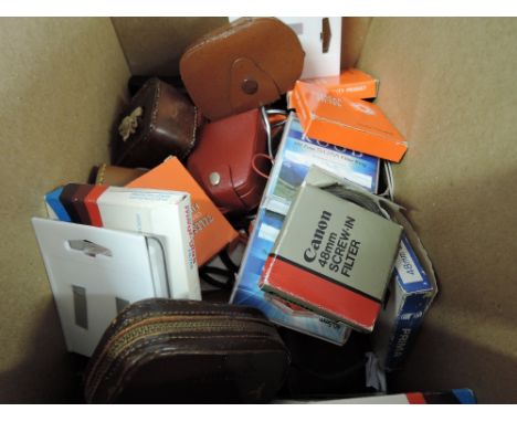 A box of light meters and various filters