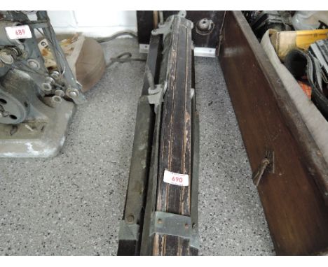 A large wooden tripod