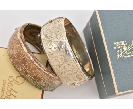 TWO HINGED BANGLES, the first a silver bangle with box, foliate pattern with push button clasp and additional safety chain, h