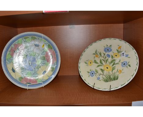 TWO RADFORD POTTERY CHARGERS, one painted with blue and yellow flowers, printed backstamp and painted marks to base 'AM. FN',