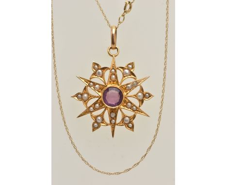 A YELLOW METAL AMETHYST AND SEED PEARL PENDANT AND CHAIN, circular star shape pendant set with a central circular cut amethys