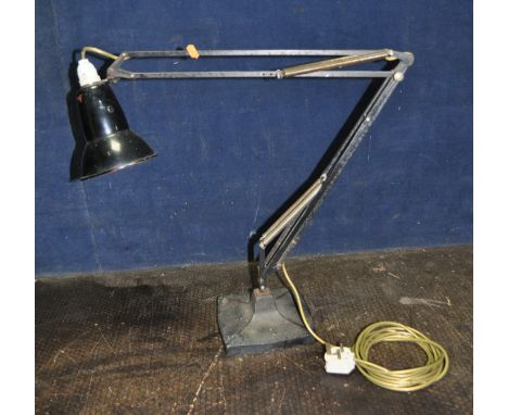 GEORGE CARWARDINE FOR ANGLE POISE, A MID 20th CENTURY ARTICULATED DESK LAMP, model 1208, with a flared and shaped cast iron b