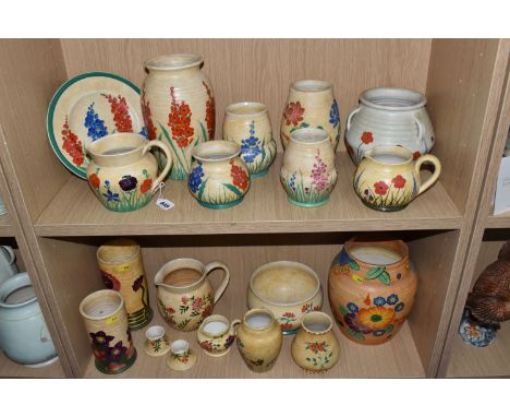 NINETEEN PIECES OF RADFORD POTTERY, in various patterns, painted with flowers on mottled ochre/orange/yellow grounds, to incl