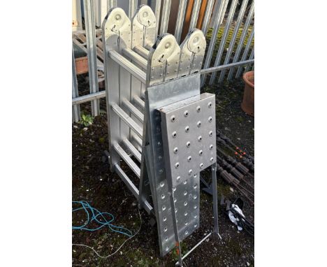 AN ALUMINIUM FOLDING PLATFORM LADDER, with three loose platforms