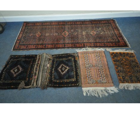 A RED AND BLUE GROUND CARPET RUNNER, with repeating geometric patterns, surrounded by a multi-strap border, 250cm x 100cm, a 
