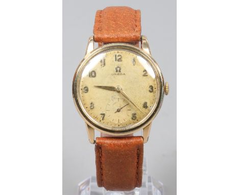 A gentlemans vintage gold capped Omega manual wristwatch with applied markers and with subsidiary seconds.