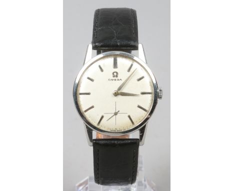 A gentlemans vintage stainless steel Omega manual wristwatch with satin dial, baton markers and subsidiary seconds.