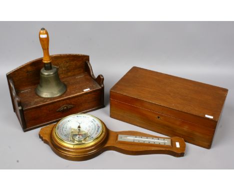 A carved oak glove box, mahogany writing box, mahogany banjo barometer British made by Shortland, along with a ARP hand bell.