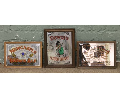 Three advertising mirrors for Dewars Scotch Whisky, Ballantines Scotch Whisky and Newcastle Brown Ale.