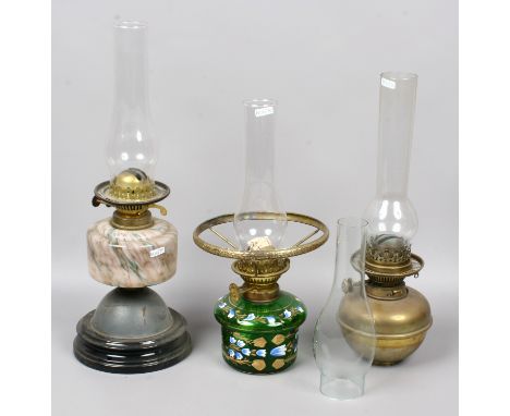 An antique oil lamp with marble effect glass font along with two part oil lamps including Hinks Duplex example.