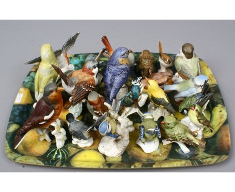 Twenty two small and miniature Goebel coloured bisque models of birds in naturalistic form.