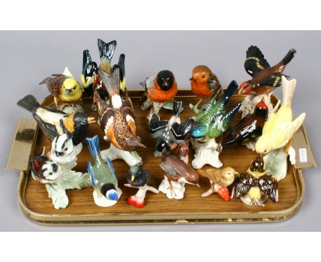 A mix of fifteen Goebel coloured bisque and glass models of birds including Robin, Yellow Hammer and Brambling etc.