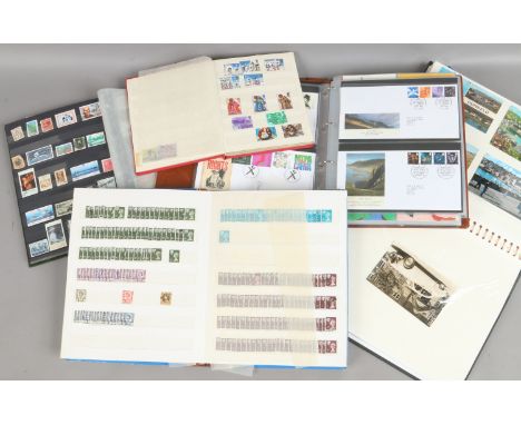 Five albums of stamps postcards and first day covers.