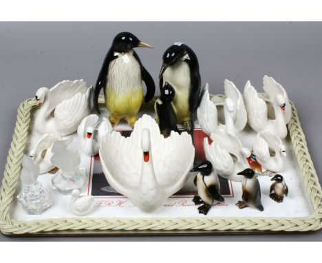 Sixteen Goebel models of birds; nine Swans, five Penguins and two Goebel crystal models.