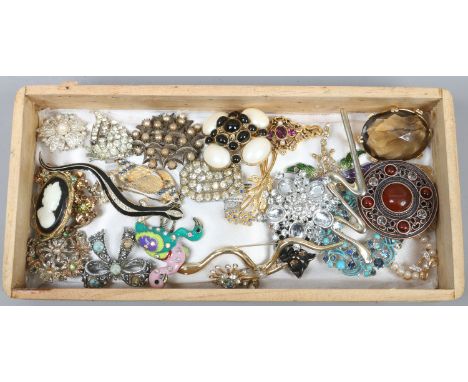 A box of costume jewellery brooches including white paste, simulated pearls and enamel examples etc.