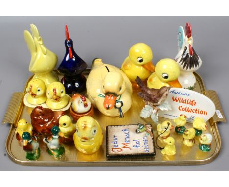 A collection of Goebel bird modelled money boxes and cruet sets along with miniature birds and two signs.
