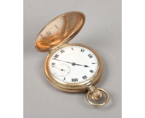 An Elgin gold plated full hunter pocket watch with white enamel dial and subsidiary seconds.