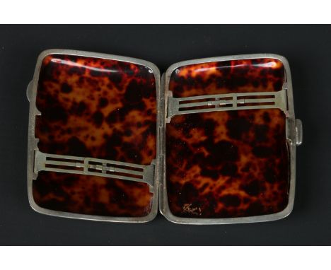 A George V silver monogrammed cigarette case with tortoise shell interior, assayed Birmingham 1926 by Gieves Limited.