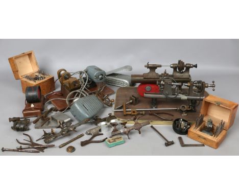 A good box of watch and clock repairers tools to include miniature belt driven laithes cased star sussie accessory kits, foot