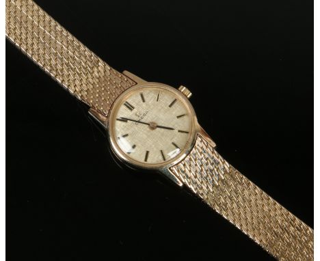 A ladies vintage 9ct gold Omega manual bracelet watch, gross weight 29.2 grams.