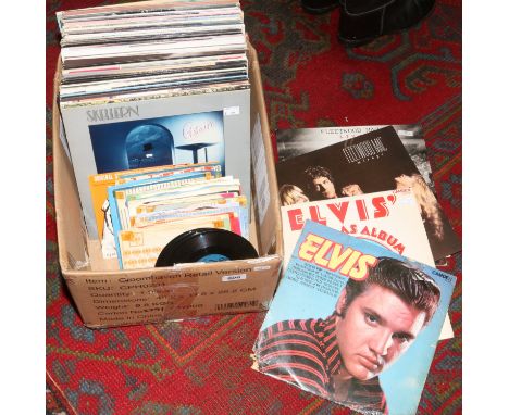 A box of L.P and single records to include Elvis, Michael Jackson, Fleetwood Mac etc.