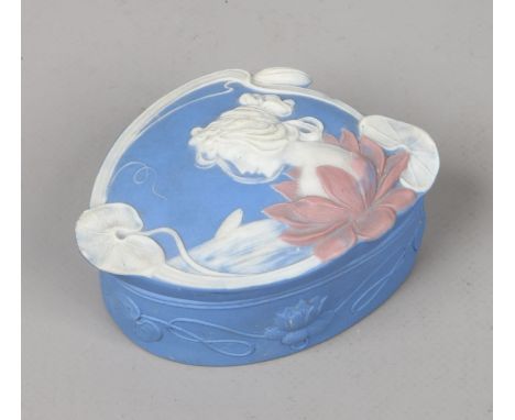 A Continental Art Nouveau Jasperware trinket box decorated with the portrait of a maiden, 8.5cm wide. Condition Report. To be