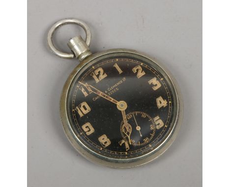 A vintage Carley & Clemence military issue pocket watch with black enamel dial and subsidiary seconds, broad arrow mark to th