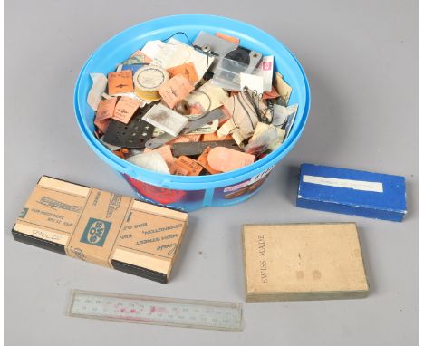 A box of assorted watch/jewellery spares and tools.