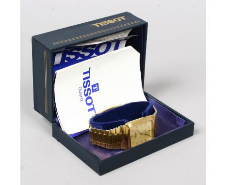 A boxed vintage gold plated Tissot 125 gents quartz bracelet watch, crown missing.