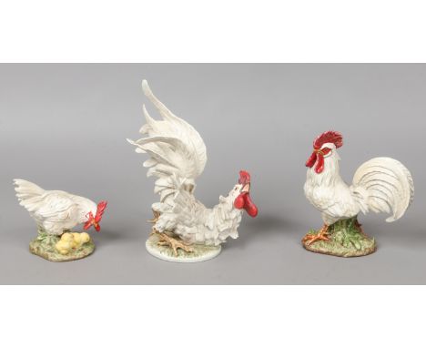Three Goebel models; two cockerels and a hen with chicks.