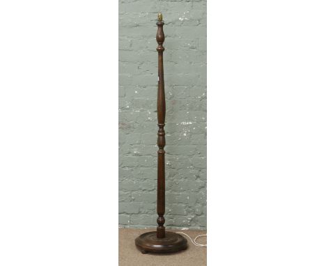 A 1940s turned standard lamp.
