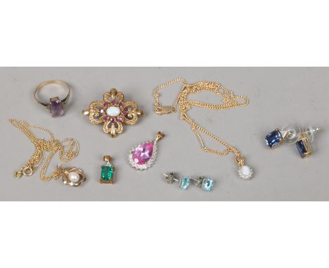 A quantity of 9 carat gold gem set jewellery; two pairs of earrings, two pendants, an amethyst ring, opal and garnet brooch a