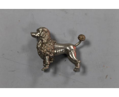 A VINTAGE NOVELTY TAPE MEASURE IN THE FORM OF A POODLE
