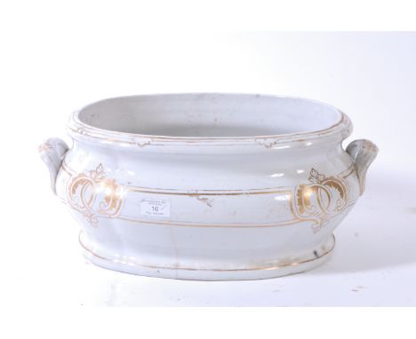 A large 19th century Victorian Staffordshire foot basin /planter. White glaze ground with gilt decorated highlights, the loze