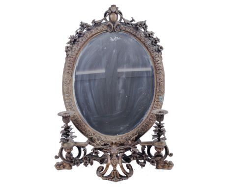 A 19th Century Victorian brass worked girandole Ladies dressing table mirror.&nbsp; The mirror of oval form housing a single 