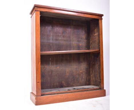 A 19th century Victorian walnut open upright library open window bookcase. The bookcase having a chamfered edge overhanging t