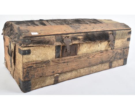 An 18th century hide covered travelling trunk chest. Dome top with remains of original hide complete with studded leading edg
