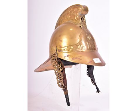 An early 20th century 1920s Australian brass fireman&rsquo;s helmet. The helmet for the Metropolitan Fire Brigade (Melbourne)