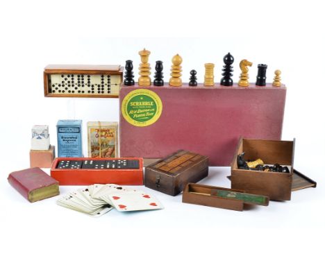 A collection of 19th Century prisoner of war bone and ebony dominoes, in boxwood case, together with another set loose, a tur