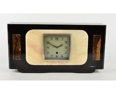 A French Art Deco mantel clock, in coloured marbles, square silvered dial with Arabic numerals and an electric movement, widt