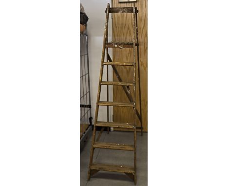 A mid 20th Century wooden step ladder, of seven tapered runs, 190 cm height, widest point 49 cm 