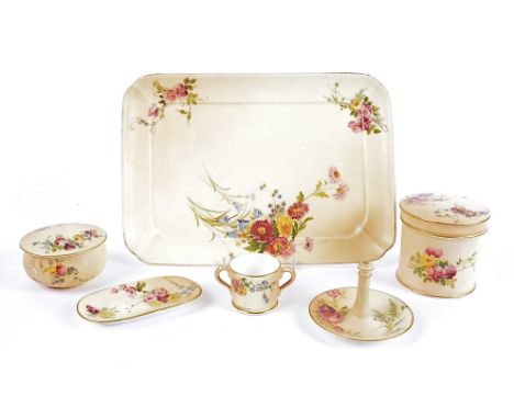 A Royal Worcester blush ivory dressing table set, with painted floral spray, comprising a tray, pot and cover, ring stand, pi