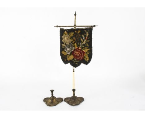 A Georgian pole fire screen,  with a shield shaped banner decorated with embroidered and beadwork flowers and foliage, attach