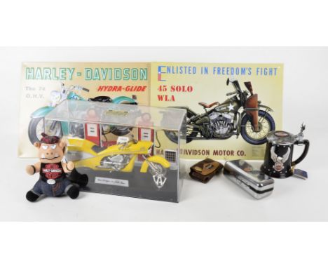 A large collection of Harley Davidson memorabilia, including a limited edition money box, books, reproduction enamel signs, r