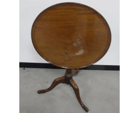 A 19th century mahogany and oak tilt top table, dished top, with oak turned column and tripod base, 60cm diameter 71cm high  