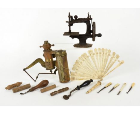 A patent steam engine gauge by Elliott Bros London, no.4633, together with a cast iron sewing machine mechanism, a quantity o