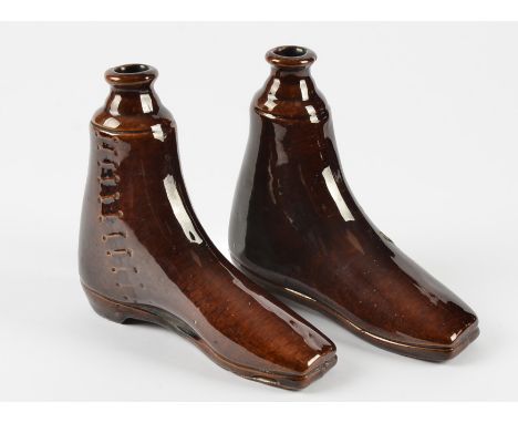 A pair of Rockingham stoneware treacle glaze spirit flask modelled as side lace up boots,  16 cm x 18 cm 