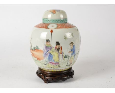 A Chinese ginger jar and cover, probably late Qing dynasty, with over glaze enamel decoration, the lower border with lotus pa